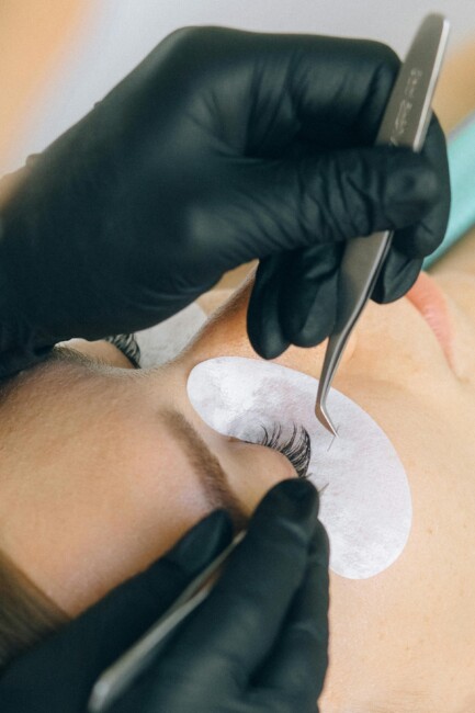 artificial eyelashes being applied