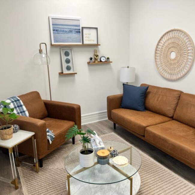 Couch, chair, and table in Hoboken Wellness Counseling room