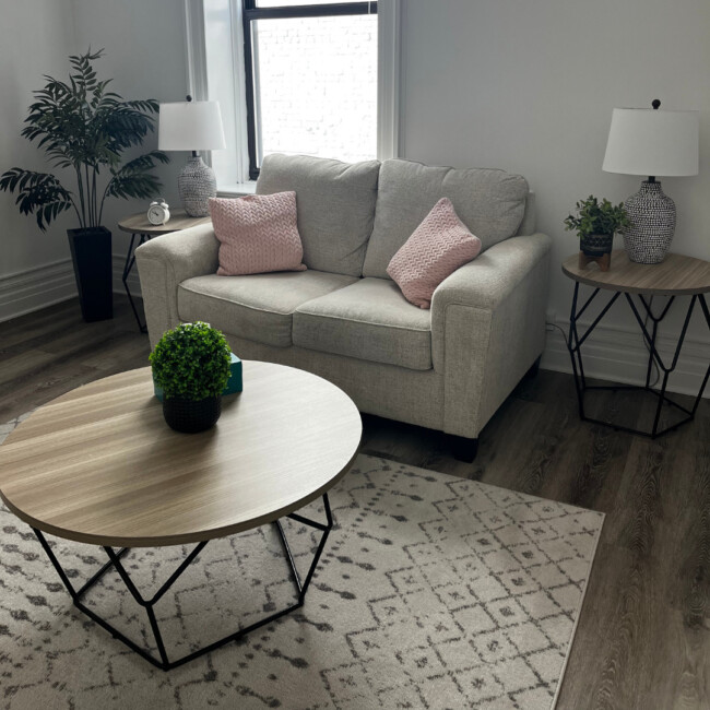 Hoboken Wellness Counseling room with loveseat and coffee table