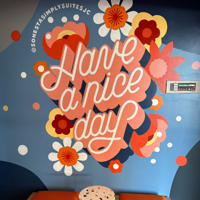 Have a Nice Day mural in Sonesta Simply Suites