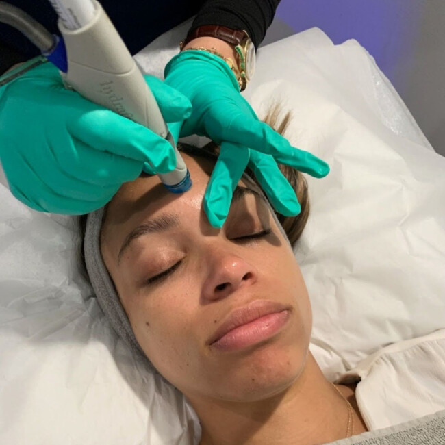 Woman receiving facial treatment at NJ Acupuncture