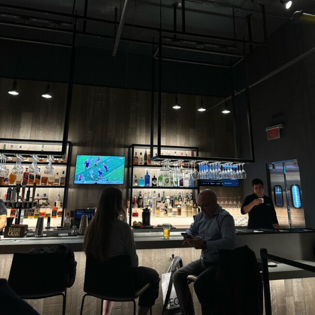 Bar at District with football on the TV