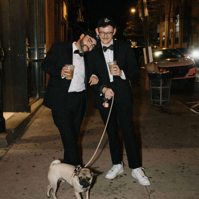 tyler, owen, and their dog boq in their hoboken engagement shoot