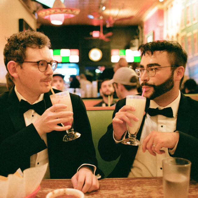 tyler + owen pose with drinks